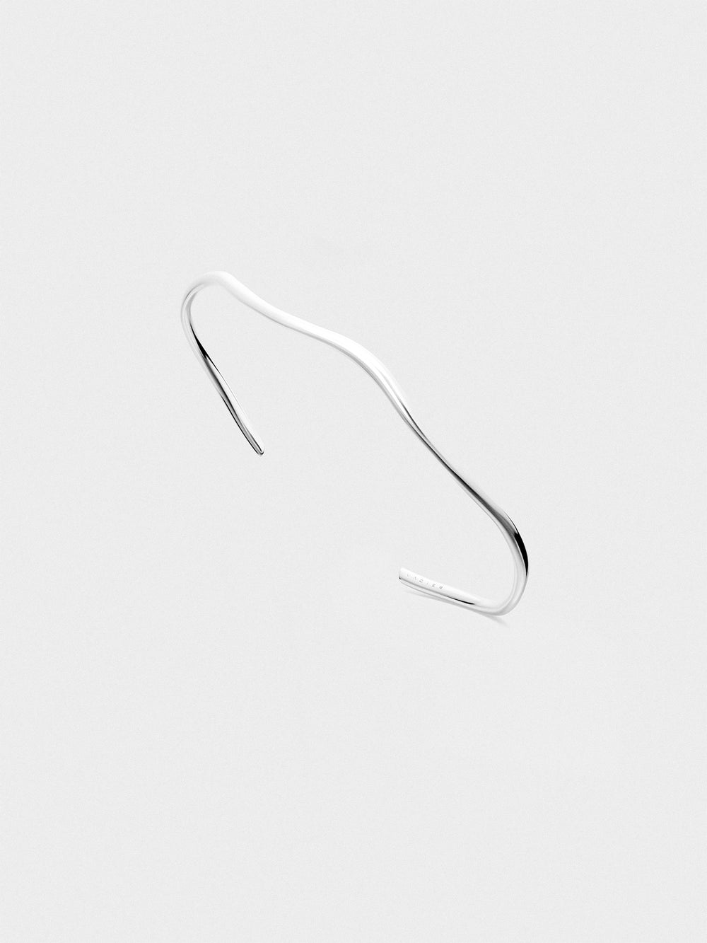 Silver cuff on a light gray background