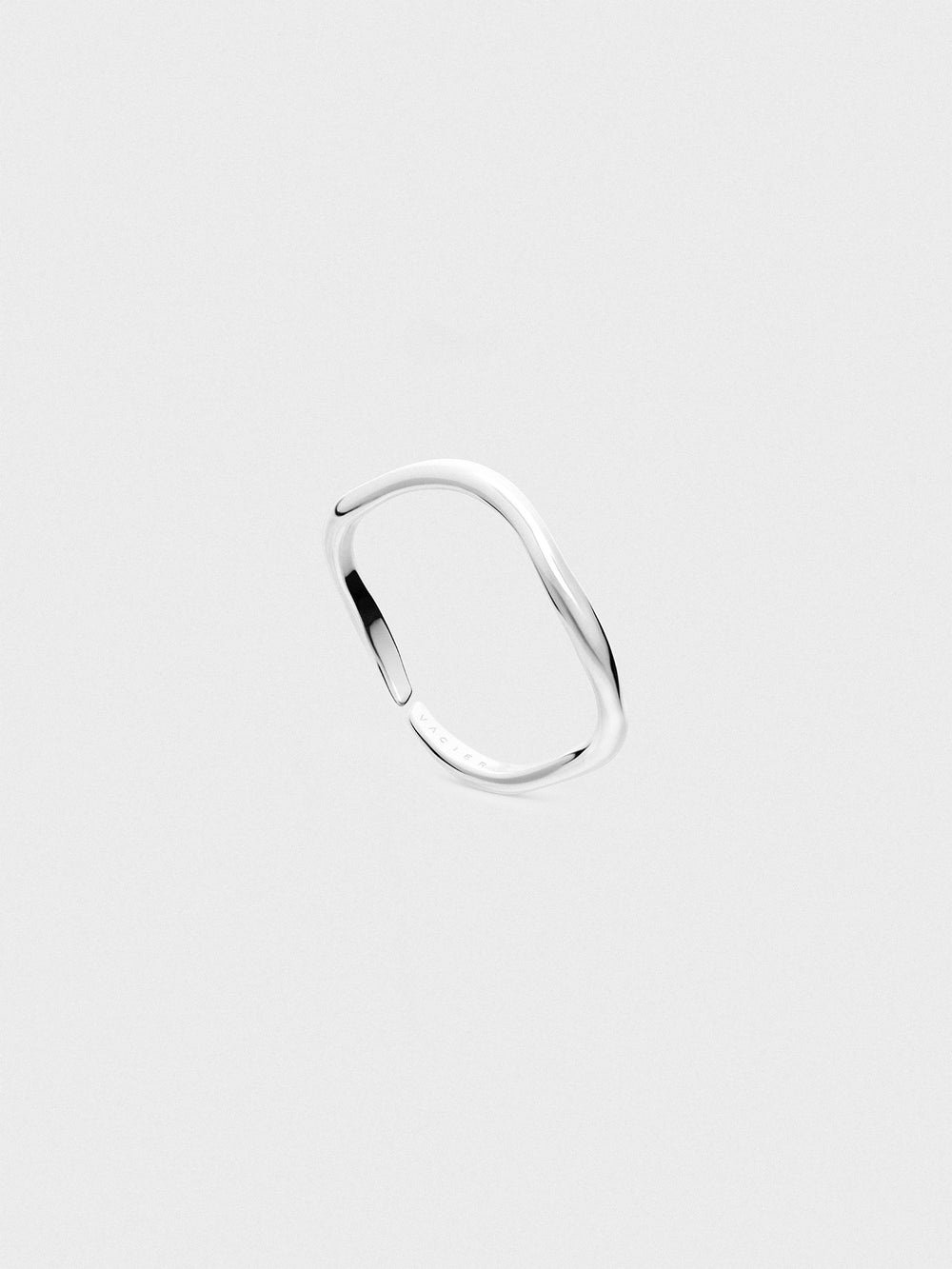Silver ring on a light gray background